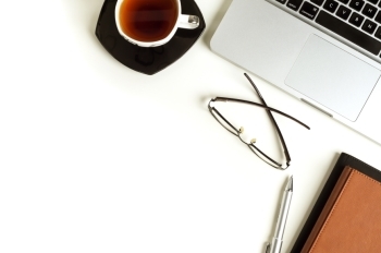 laptop and coffee on table